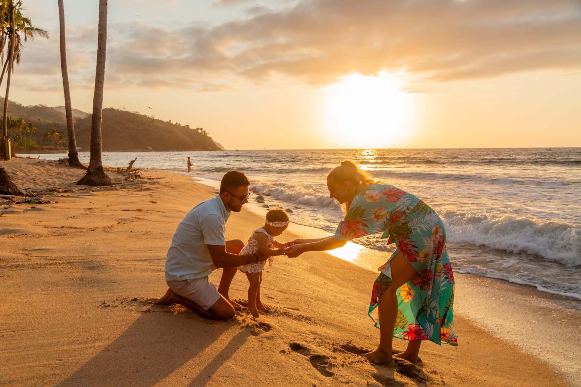 Family playing on Quimixto beach at sunset, Banderas Bay