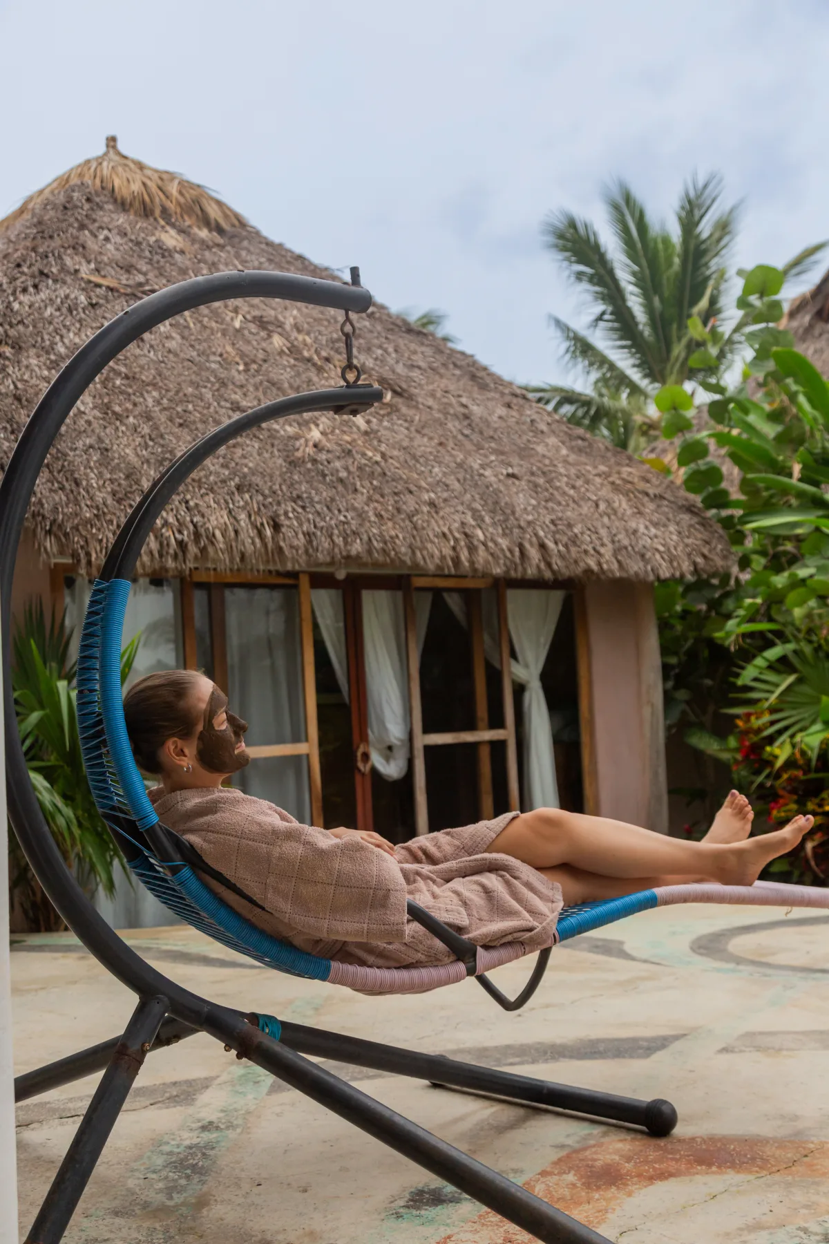 Resting in a hammock beside a room